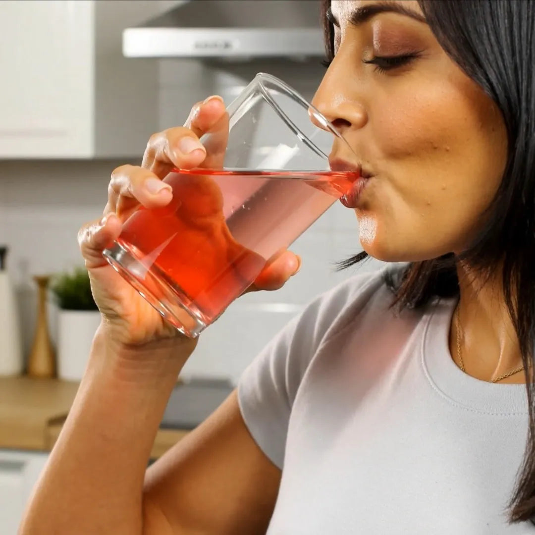 Person drinking Hydromend calm hydration after mixing electrolytes