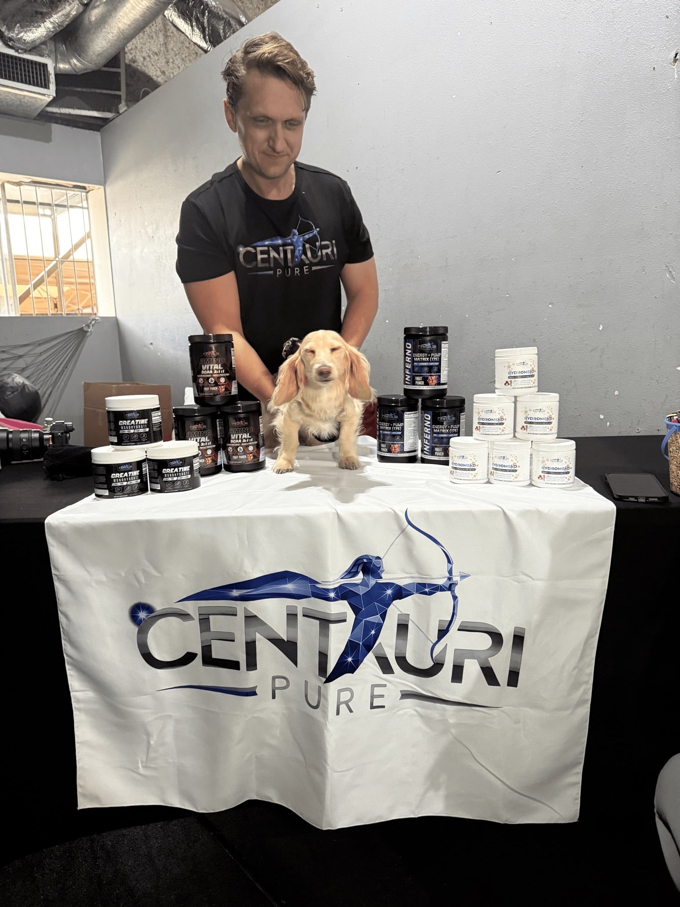 Centauri Pure booth with full product lineup at a live fitness event
